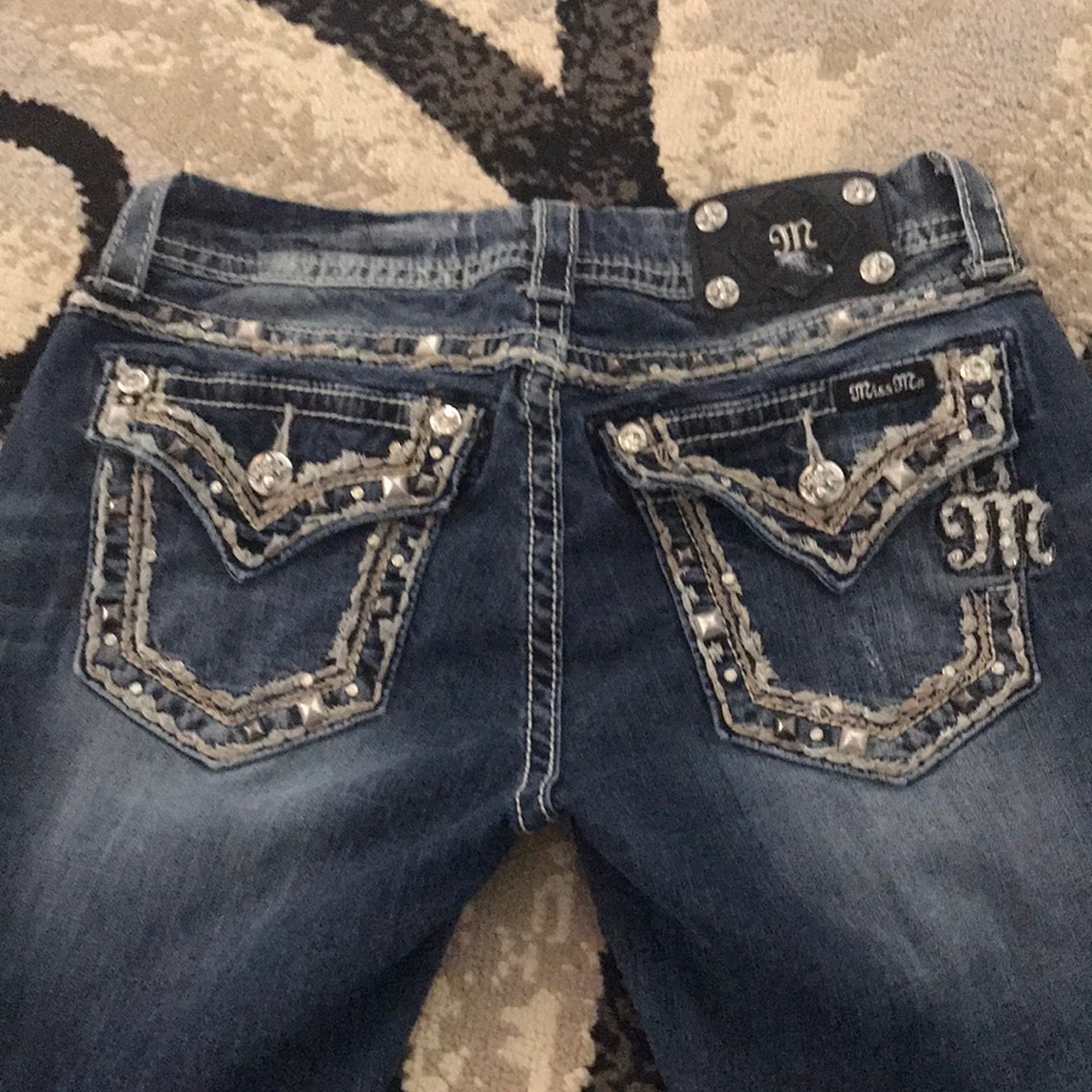 Miss Me denim distressed bootcut jeans.